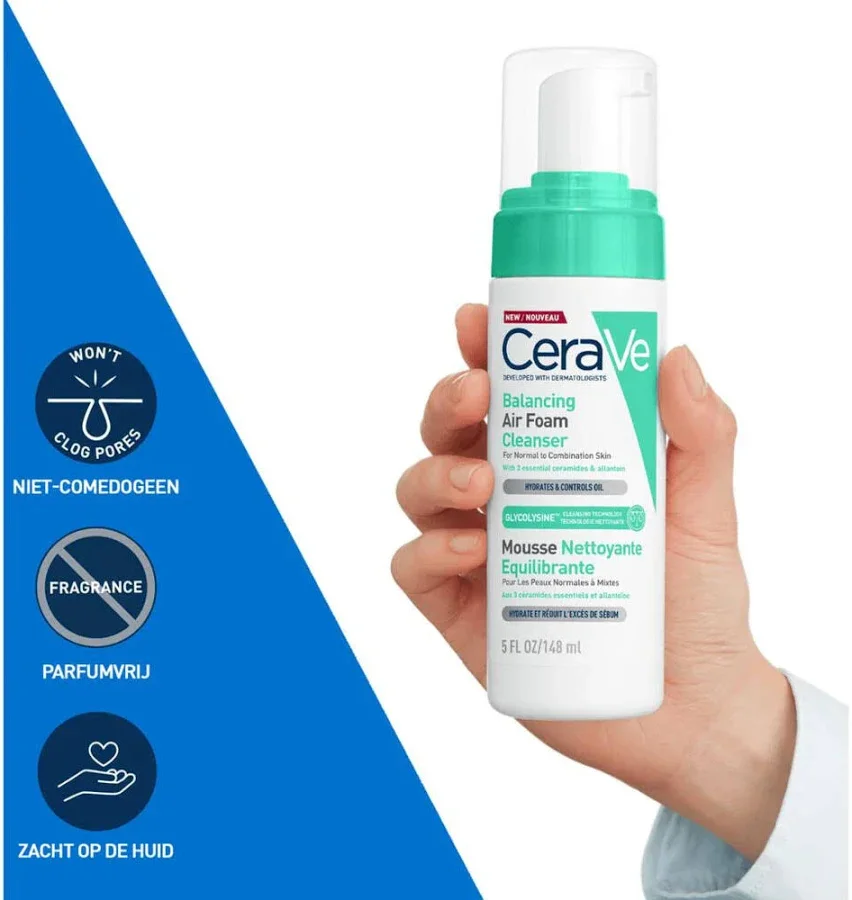 CeraVe Balancing Air Foam Cleanser bottle held in a hand with blue background promoting non-comedogenic and fragrance-free features.